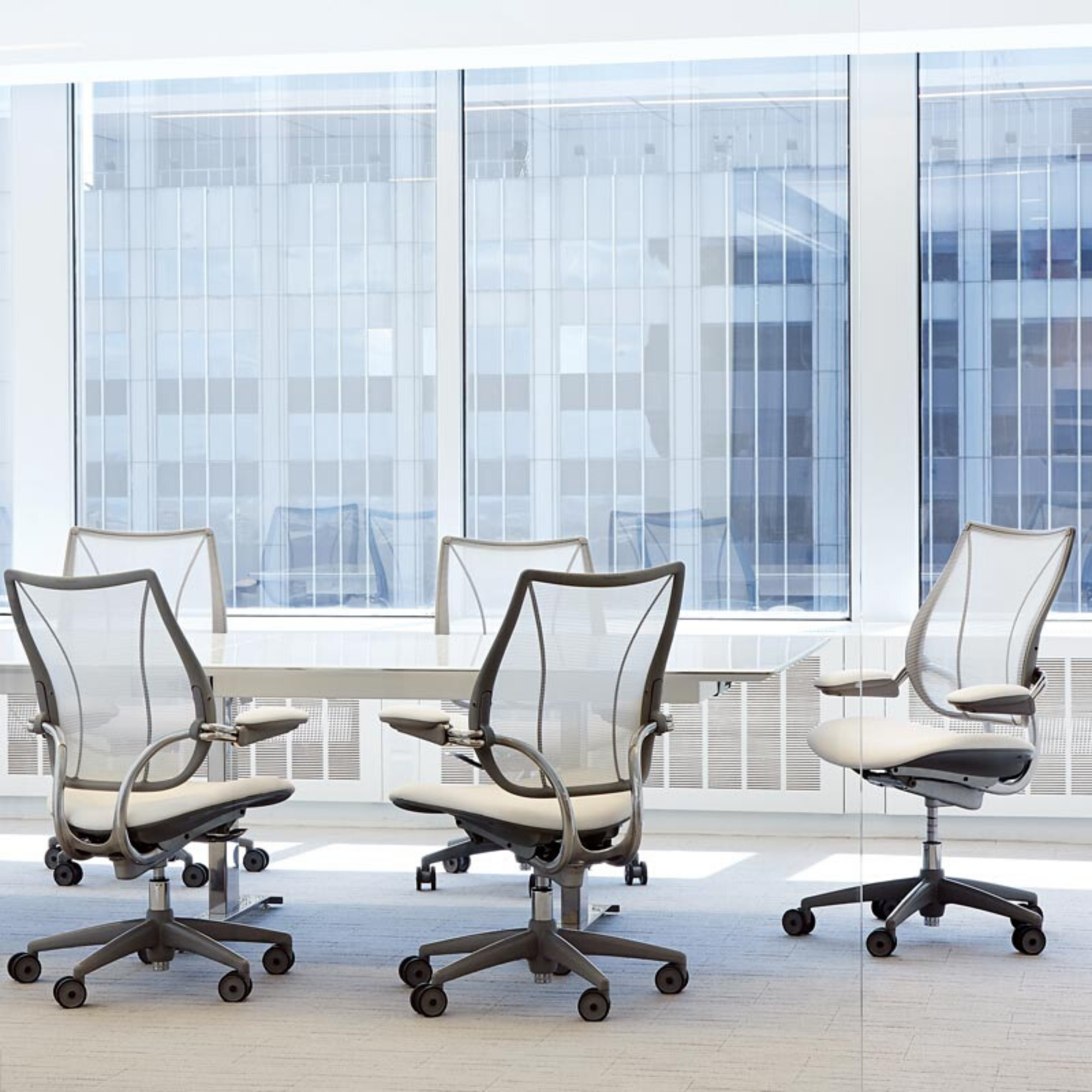 white humanscale liberty chair if office meeting room