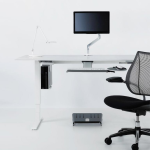 Humanscale CPU Holder 600 mounted under a white office desk