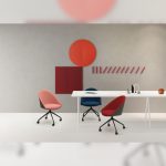 Carmel chairs in pink, blue, and red shown in a modern office background